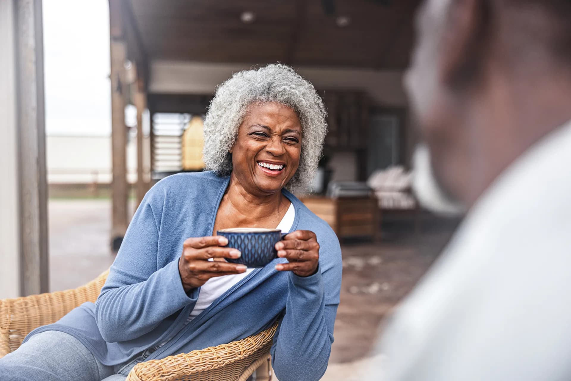 Lady figuratively spilling the tea while holding a teacup.