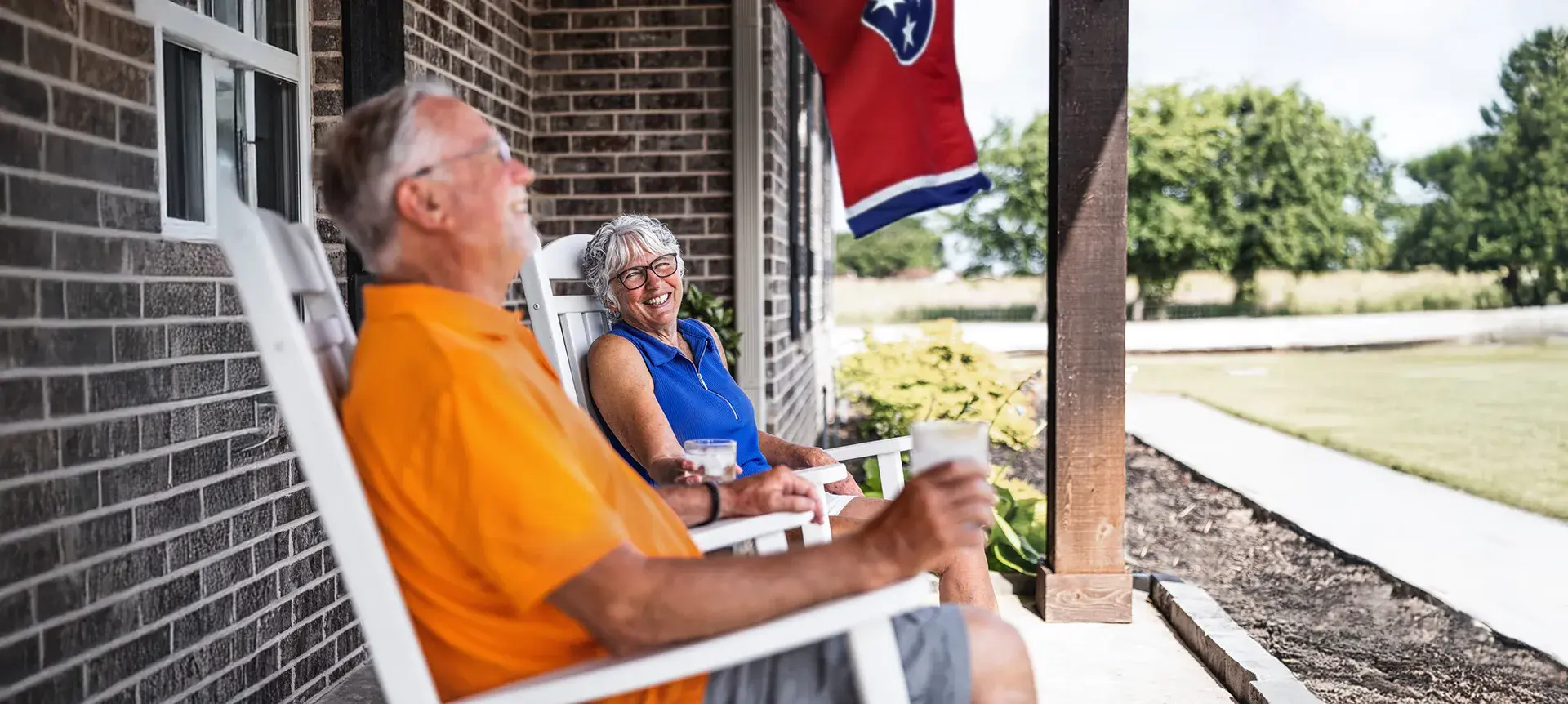 An older man and woman on porch
